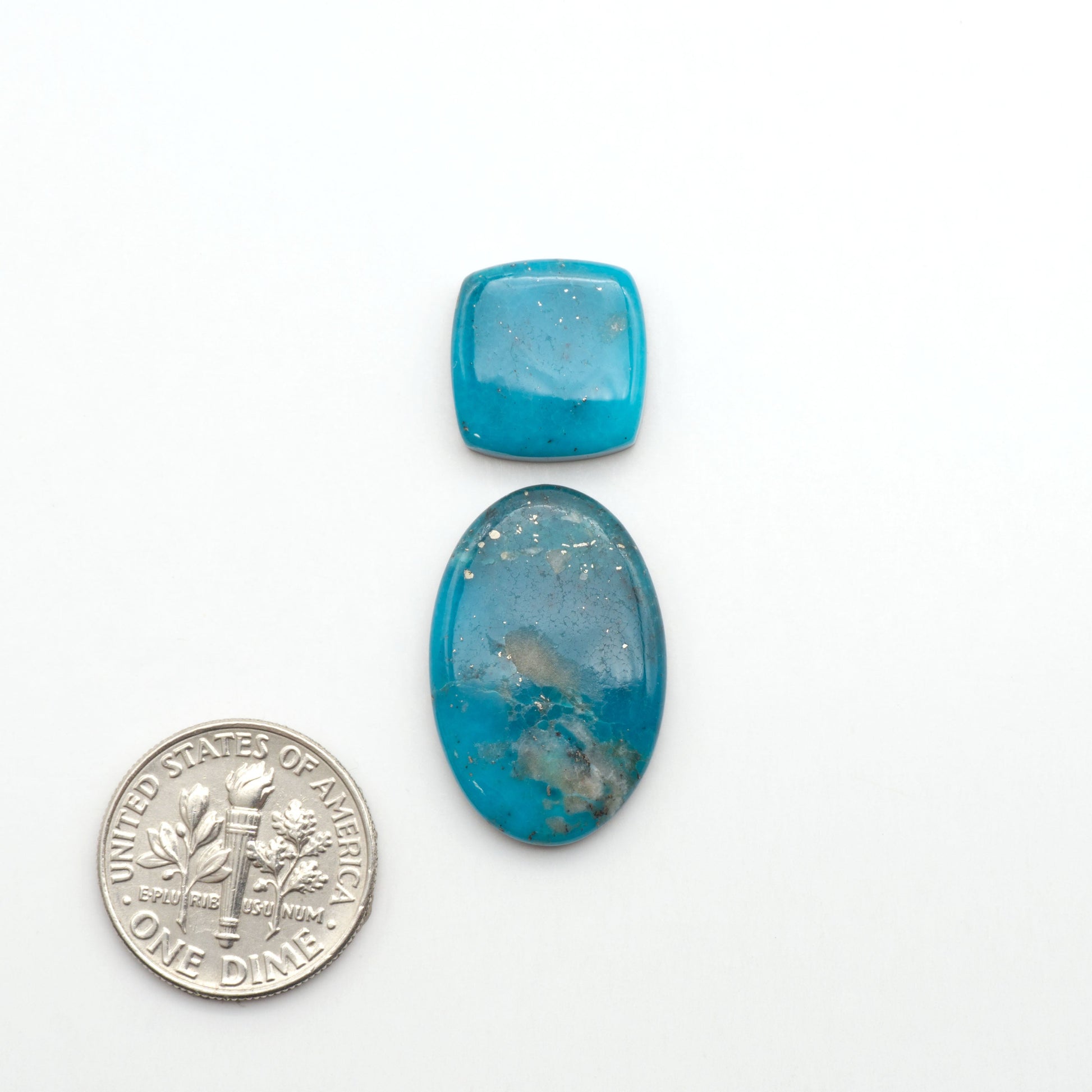 Nacozari turquoise cabochons are striking gemstones known for their vibrant blue to greenish-blue colors and pyrite, these stones are prized in jewelry making.