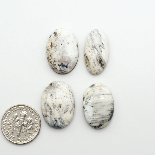 Natural White Buffalo Stone Cabochons are semi-precious gemstones cut into shapes ideal for jewelry-making, making them an excellent choice for artisans.
