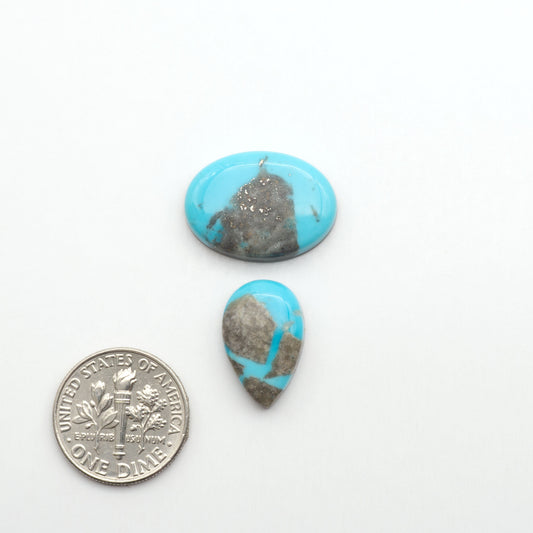 Nacozari turquoise cabochons are striking gemstones known for their vibrant blue to greenish-blue colors and pyrite, these stones are prized in jewelry making.