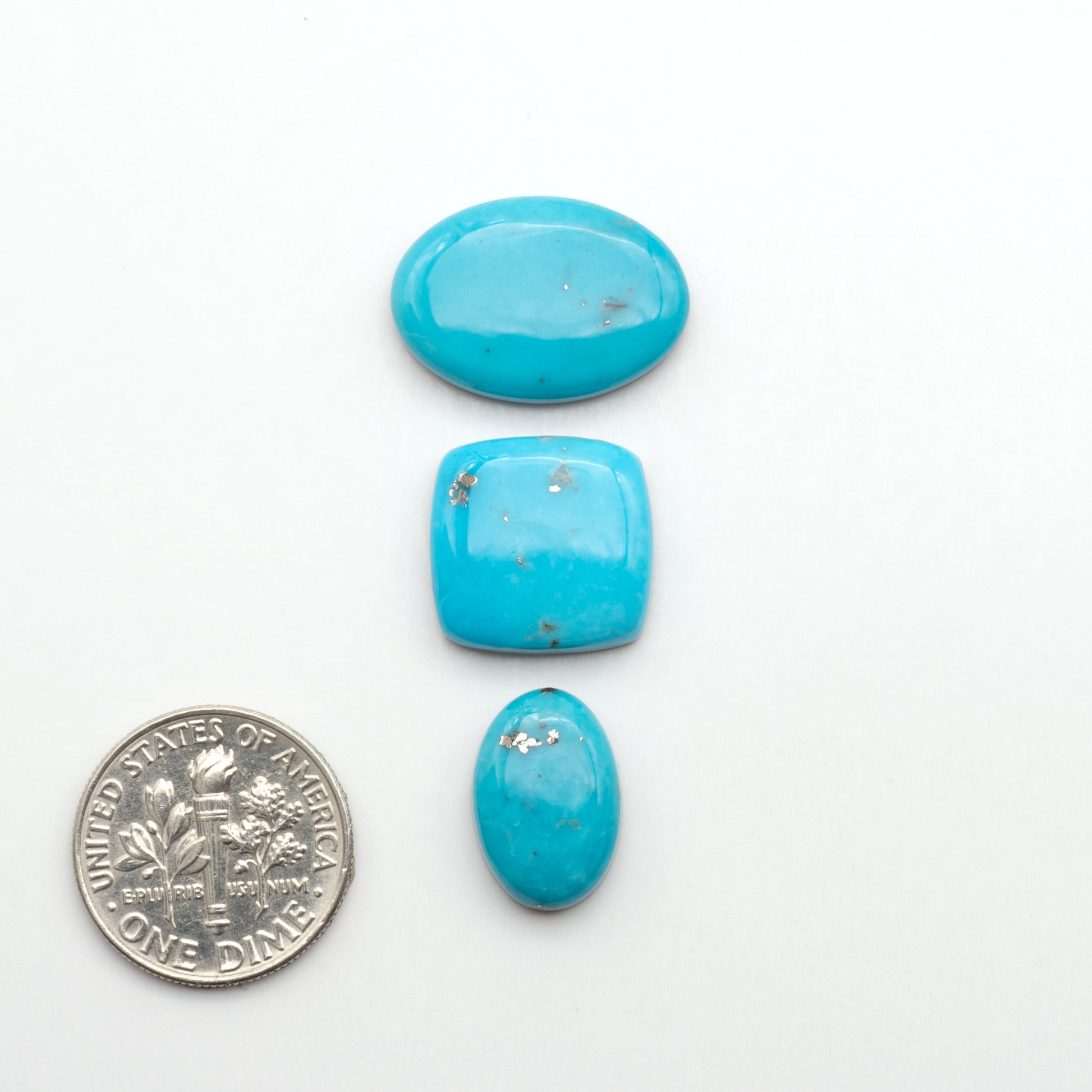Nacozari turquoise cabochons are striking gemstones known for their vibrant blue to greenish-blue colors and pyrite, these stones are prized in jewelry making.