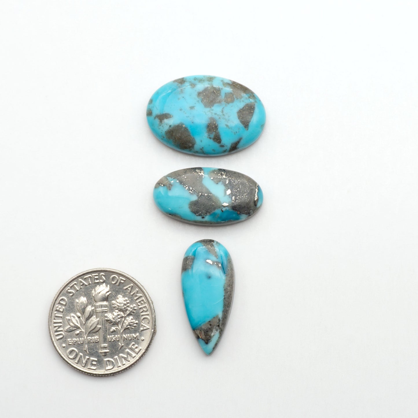 Nacozari turquoise cabochons are striking gemstones known for their vibrant blue to greenish-blue colors and pyrite, these stones are prized in jewelry making.