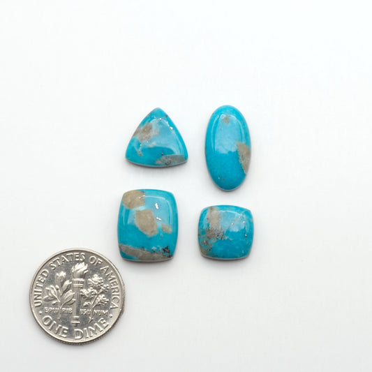 Nacozari turquoise cabochons are striking gemstones known for their vibrant blue to greenish-blue colors and pyrite, these stones are prized in jewelry making.