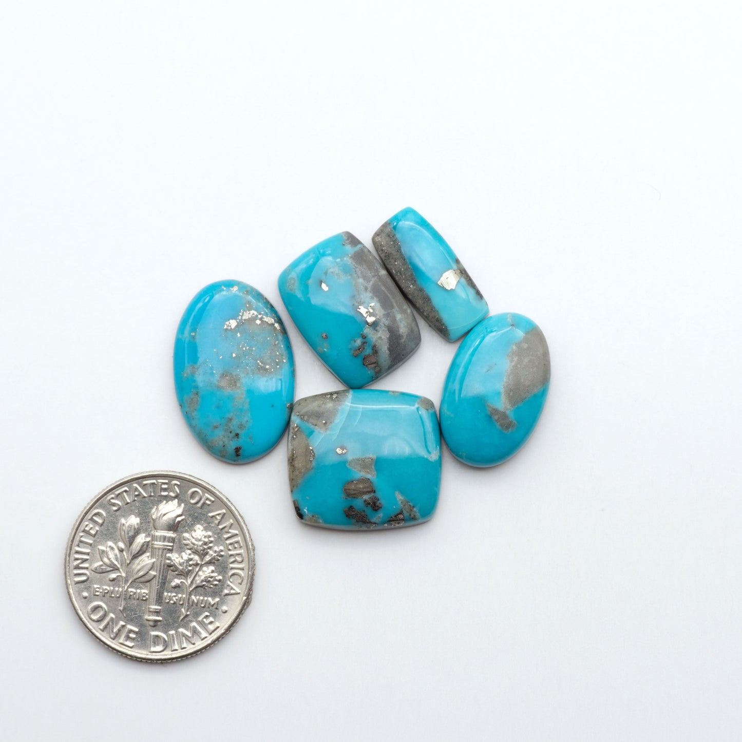 Nacozari turquoise cabochons are striking gemstones known for their vibrant blue to greenish-blue colors and pyrite, these stones are prized in jewelry making.