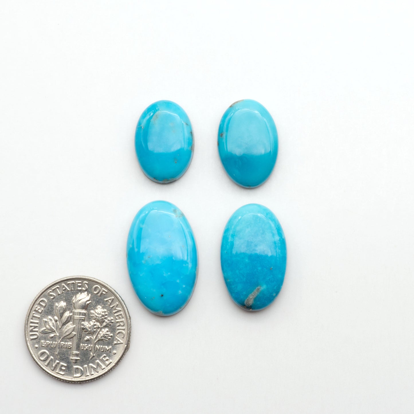 Nacozari turquoise cabochons are striking gemstones known for their vibrant blue to greenish-blue colors and pyrite, these stones are prized in jewelry making.