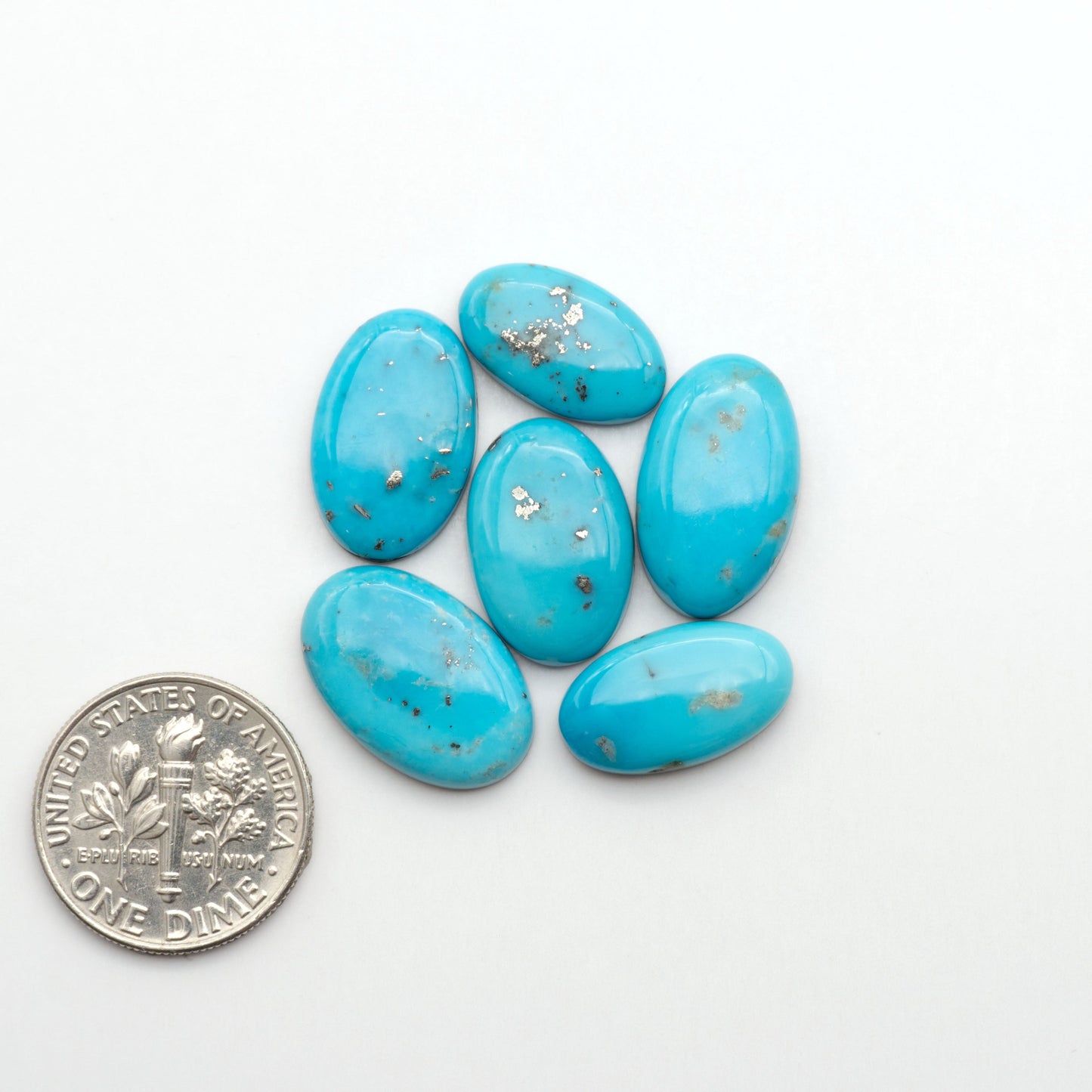 Nacozari turquoise cabochons are striking gemstones known for their vibrant blue to greenish-blue colors and pyrite, these stones are prized in jewelry making.