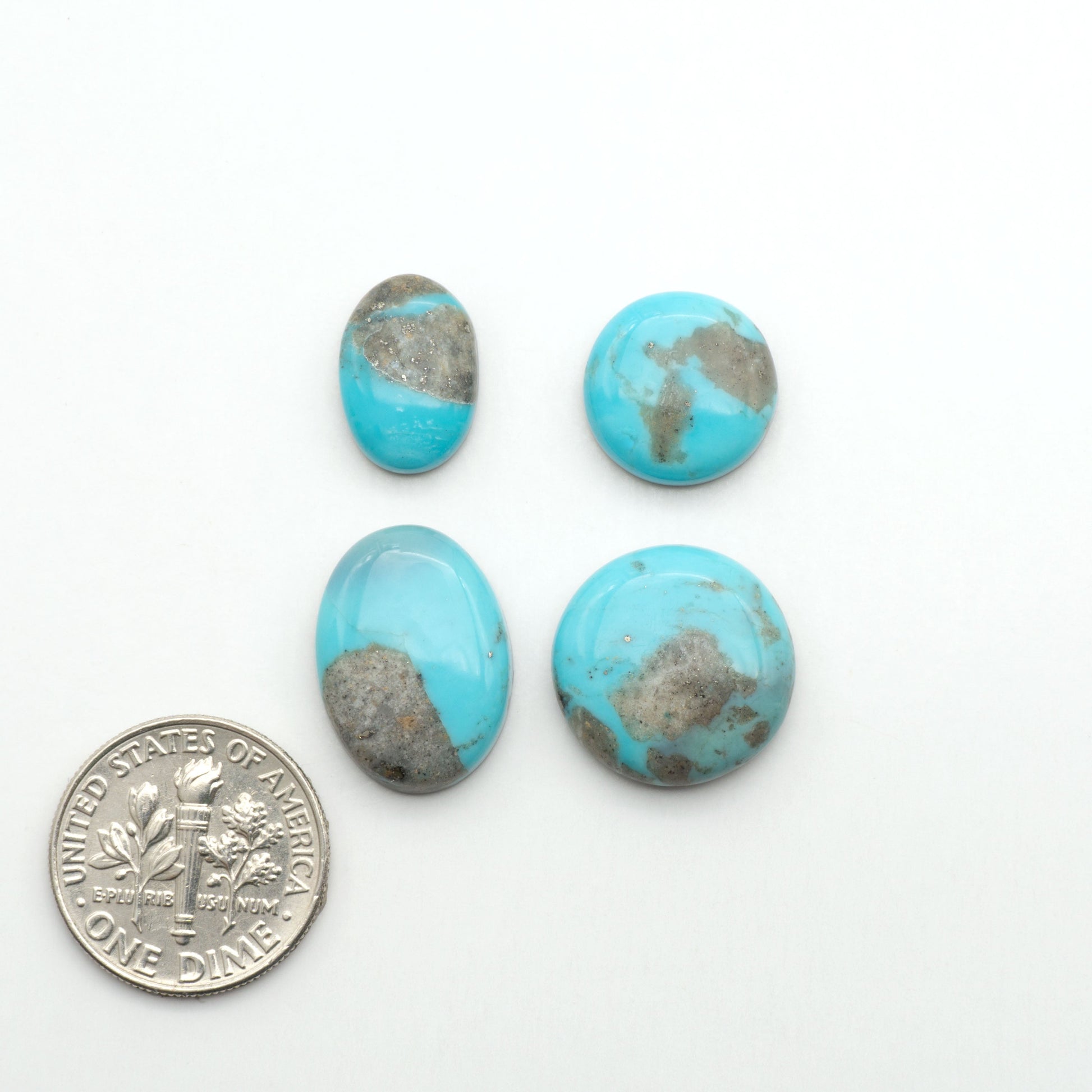 Nacozari turquoise cabochons are striking gemstones known for their vibrant blue to greenish-blue colors and pyrite, these stones are prized in jewelry making.