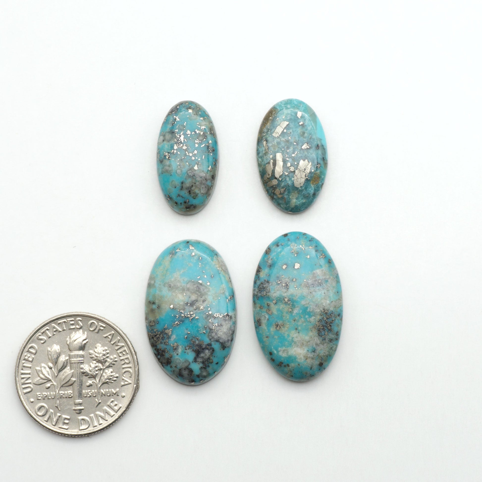 Nacozari turquoise cabochons are striking gemstones known for their vibrant blue to greenish-blue colors and pyrite, these stones are prized in jewelry making.