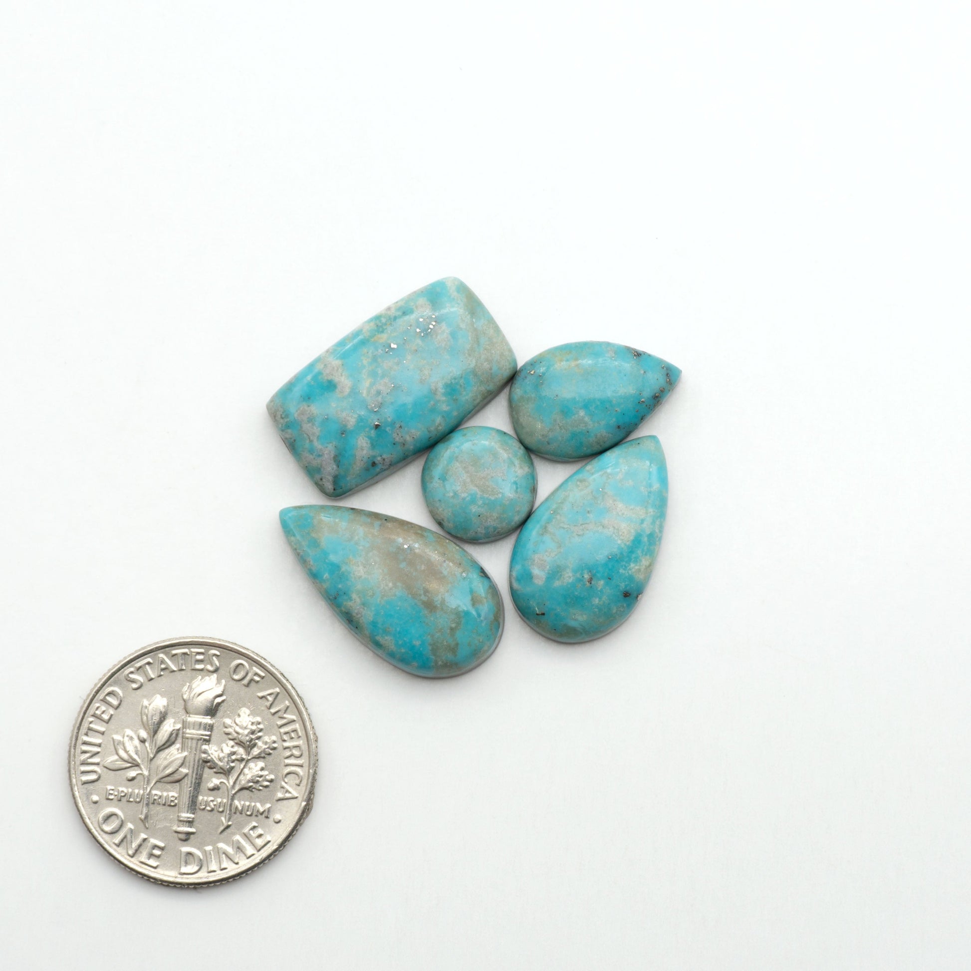 Nacozari turquoise cabochons are striking gemstones known for their vibrant blue to greenish-blue colors and pyrite, these stones are prized in jewelry making.