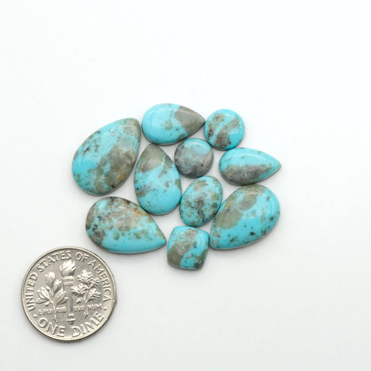 Nacozari turquoise cabochons are striking gemstones known for their vibrant blue to greenish-blue colors and pyrite, these stones are prized in jewelry making.