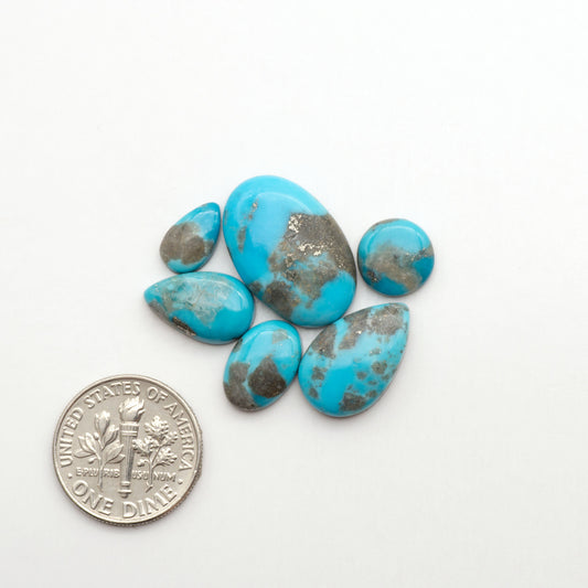 Nacozari turquoise cabochons are striking gemstones known for their vibrant blue to greenish-blue colors and pyrite, these stones are prized in jewelry making.