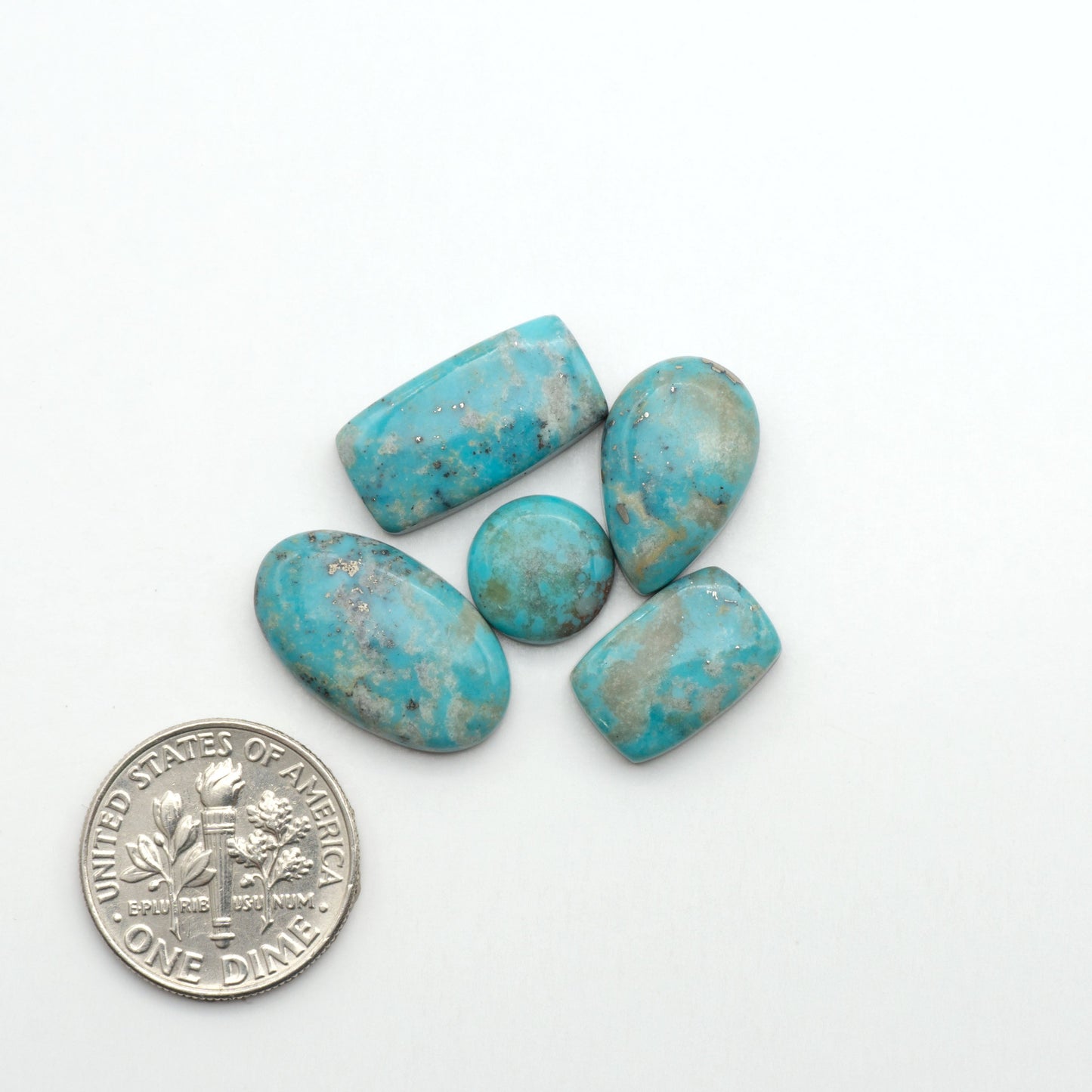 Nacozari turquoise cabochons are striking gemstones known for their vibrant blue to greenish-blue colors and pyrite, these stones are prized in jewelry making.