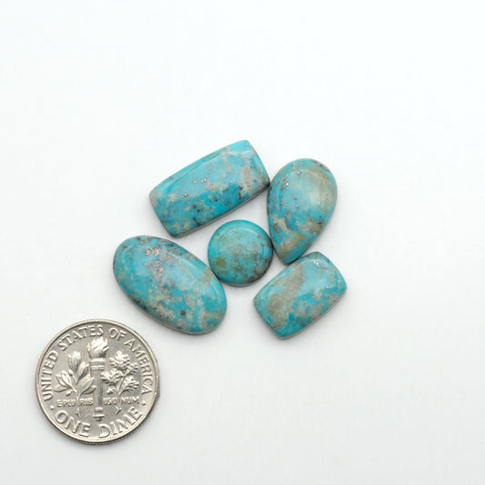 Nacozari turquoise cabochons are striking gemstones known for their vibrant blue to greenish-blue colors and pyrite, these stones are prized in jewelry making.