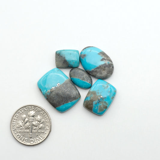 Nacozari turquoise cabochons are striking gemstones known for their vibrant blue to greenish-blue colors and pyrite, these stones are prized in jewelry making.