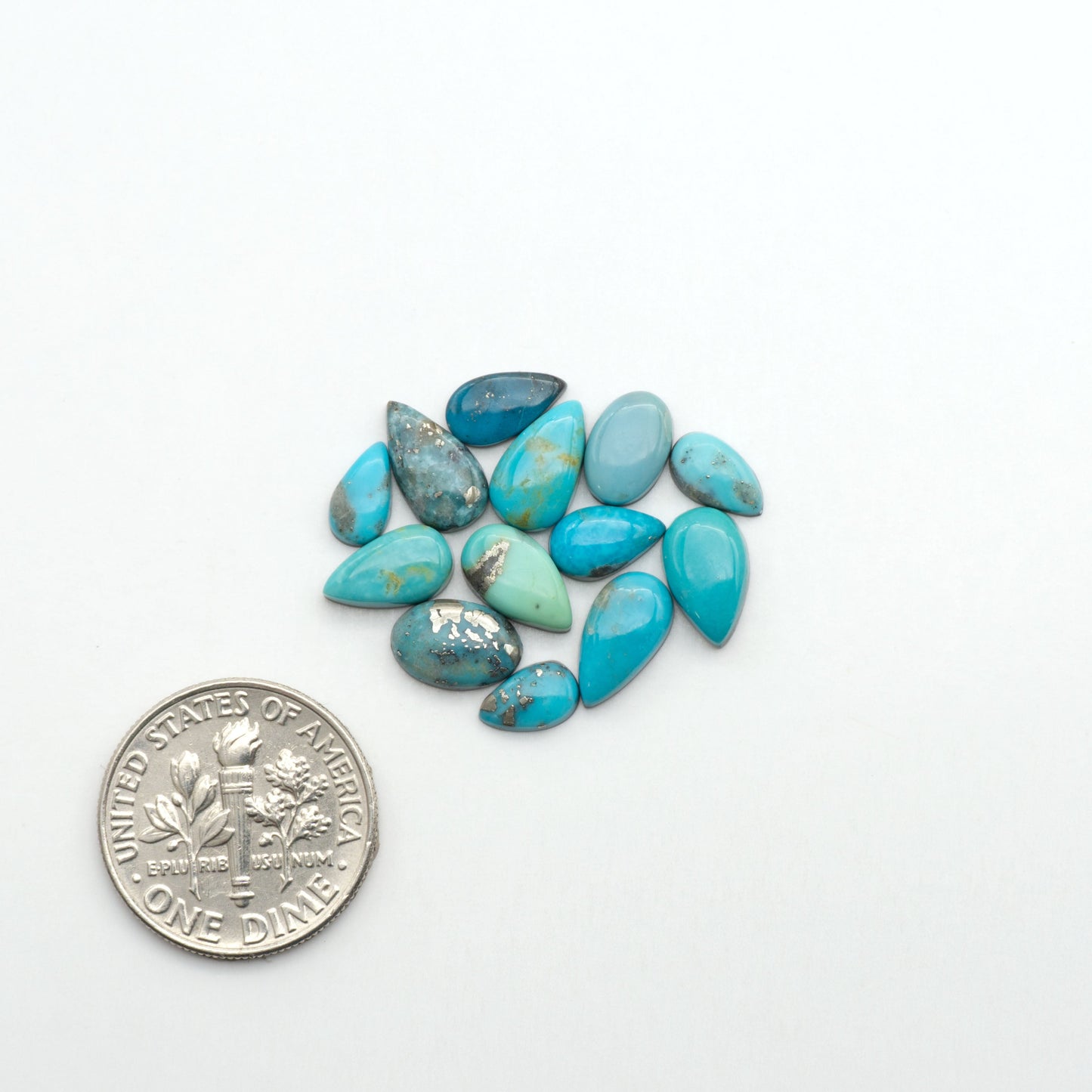 Nacozari turquoise cabochons are striking gemstones known for their vibrant blue to greenish-blue colors and pyrite, these stones are prized in jewelry making.