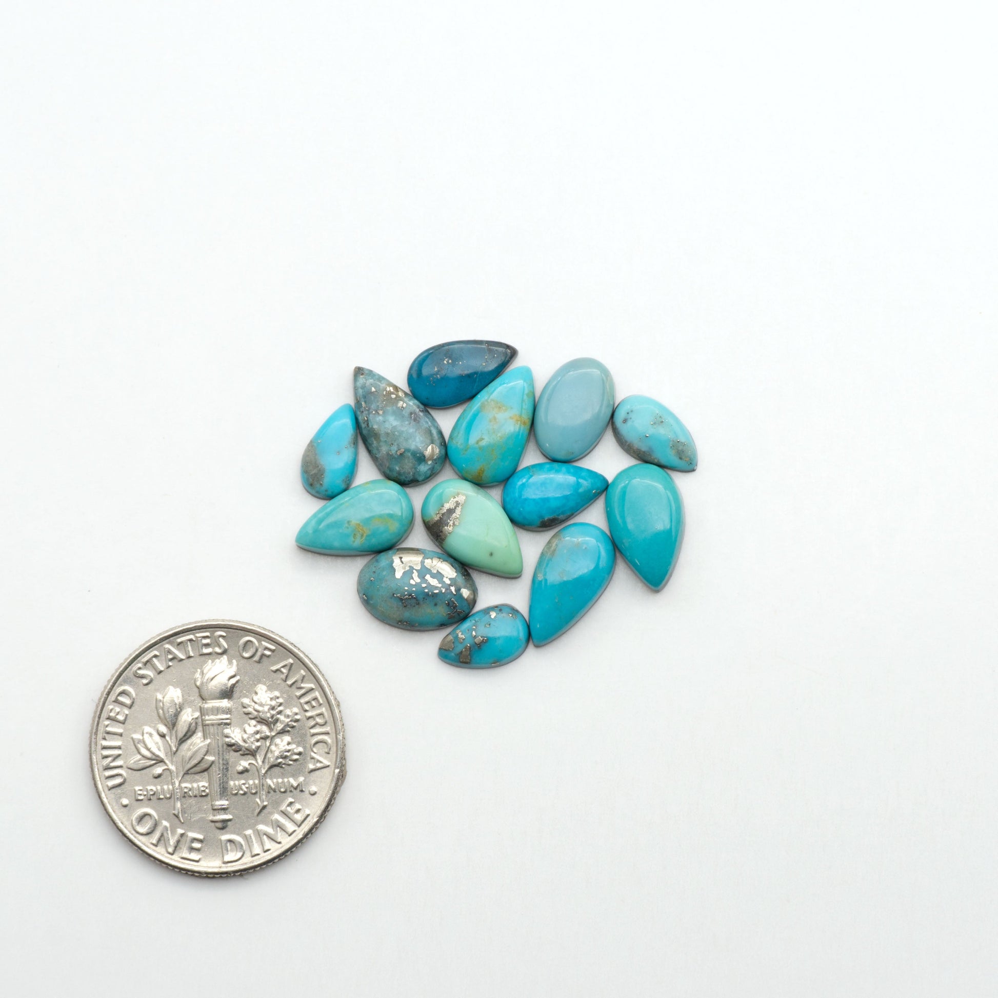 Nacozari turquoise cabochons are striking gemstones known for their vibrant blue to greenish-blue colors and pyrite, these stones are prized in jewelry making.