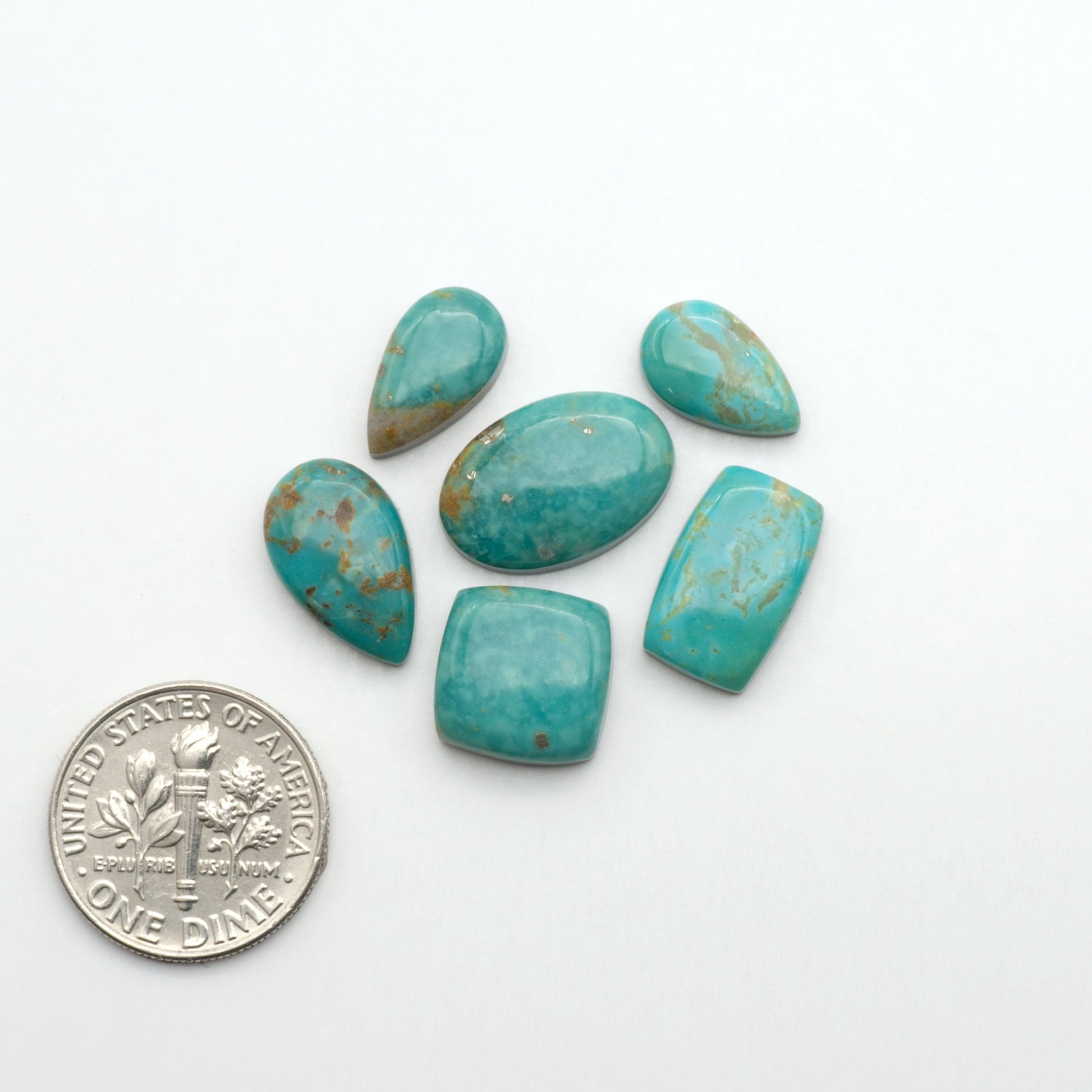Nacozari turquoise cabochons are striking gemstones known for their vibrant blue to greenish-blue colors and pyrite, these stones are prized in jewelry making.