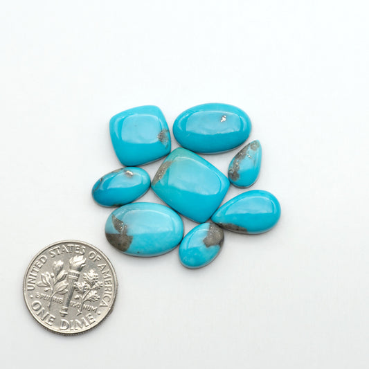 Nacozari turquoise cabochons are striking gemstones known for their vibrant blue to greenish-blue colors and pyrite, these stones are prized in jewelry making.