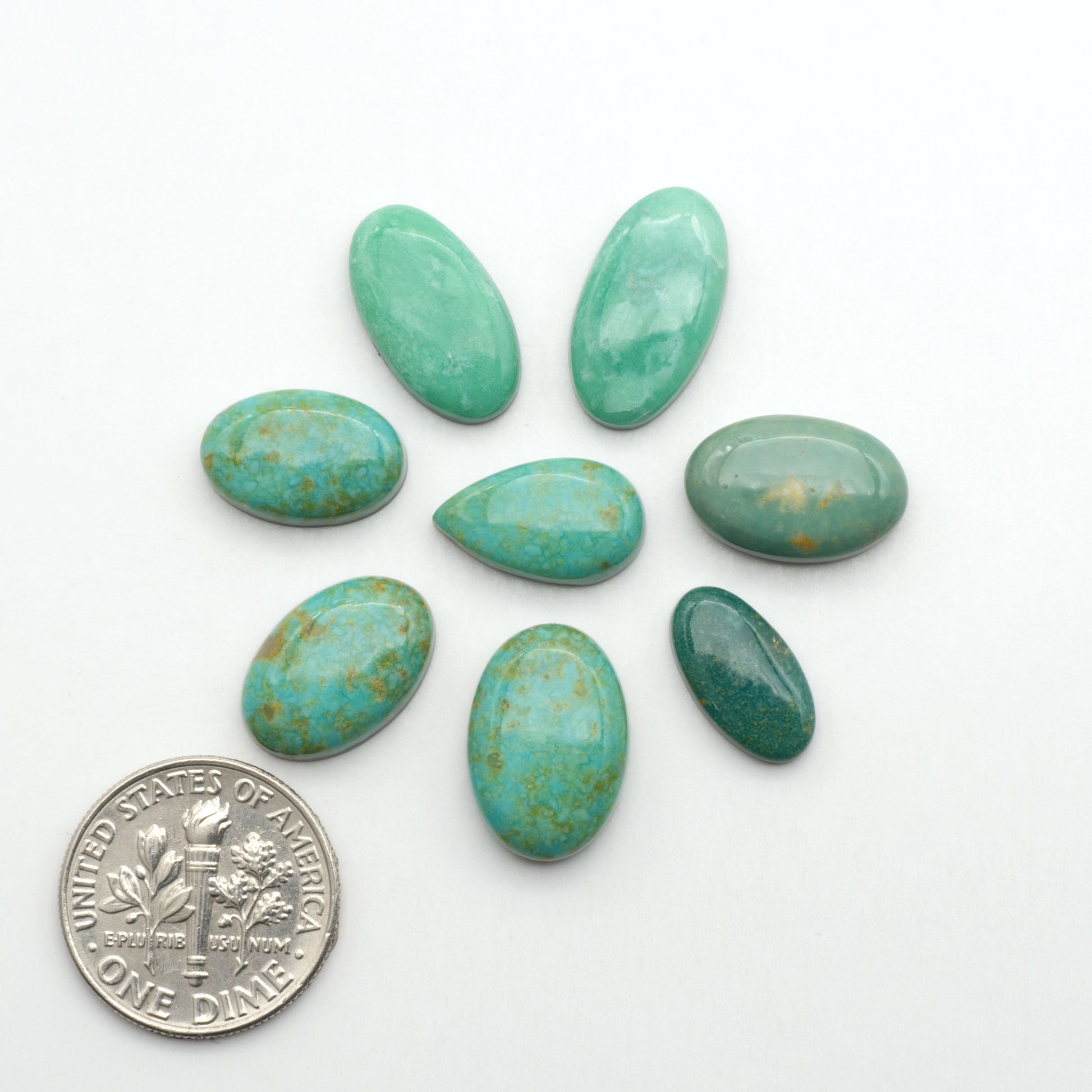 Nacozari turquoise cabochons are striking gemstones known for their vibrant blue to greenish-blue colors and pyrite, these stones are prized in jewelry making.