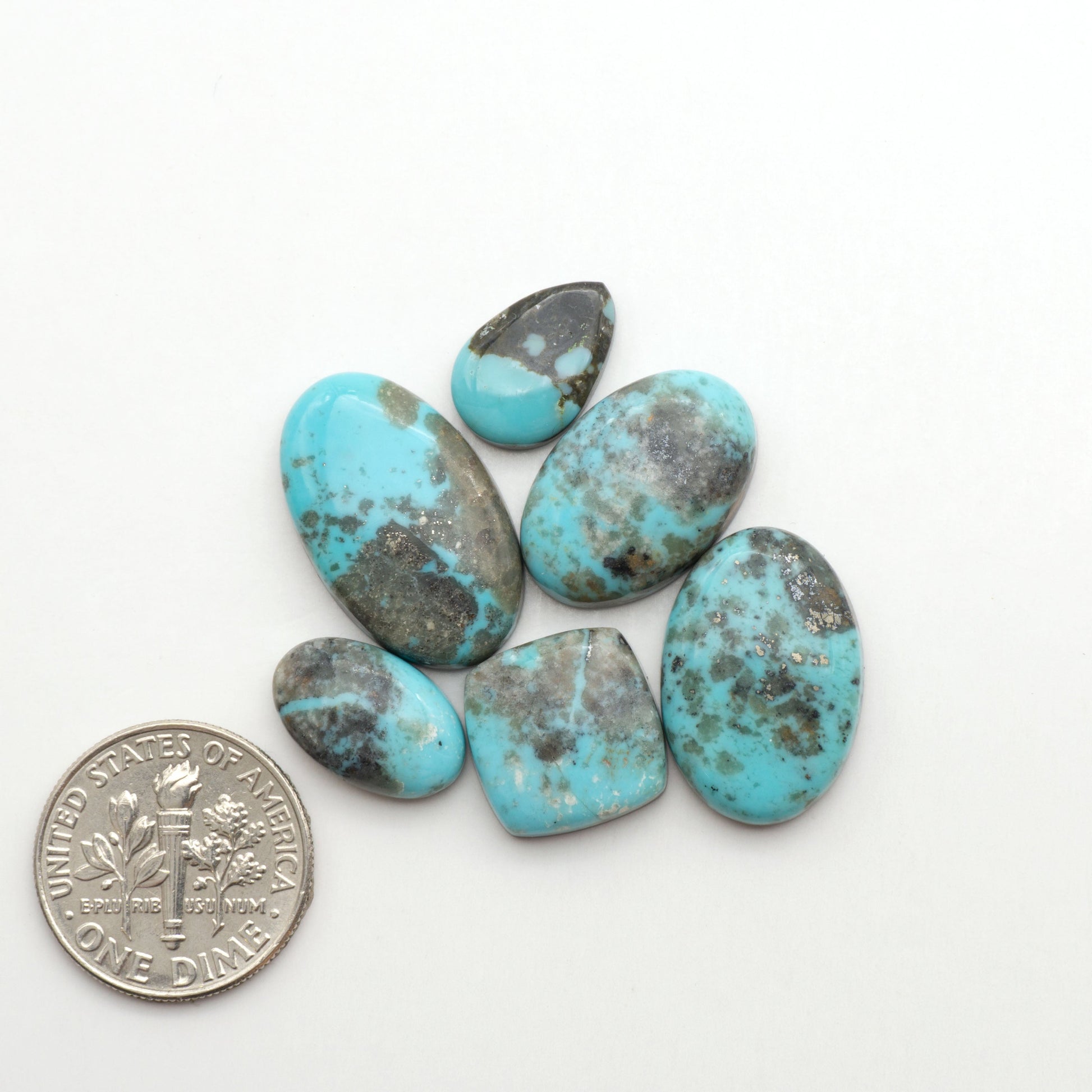 Nacozari turquoise cabochons are striking gemstones known for their vibrant blue to greenish-blue colors and pyrite, these stones are prized in jewelry making.