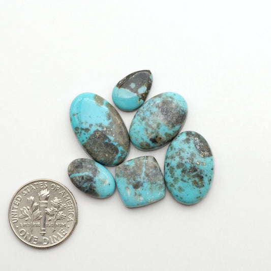 Nacozari turquoise cabochons are striking gemstones known for their vibrant blue to greenish-blue colors and pyrite, these stones are prized in jewelry making.
