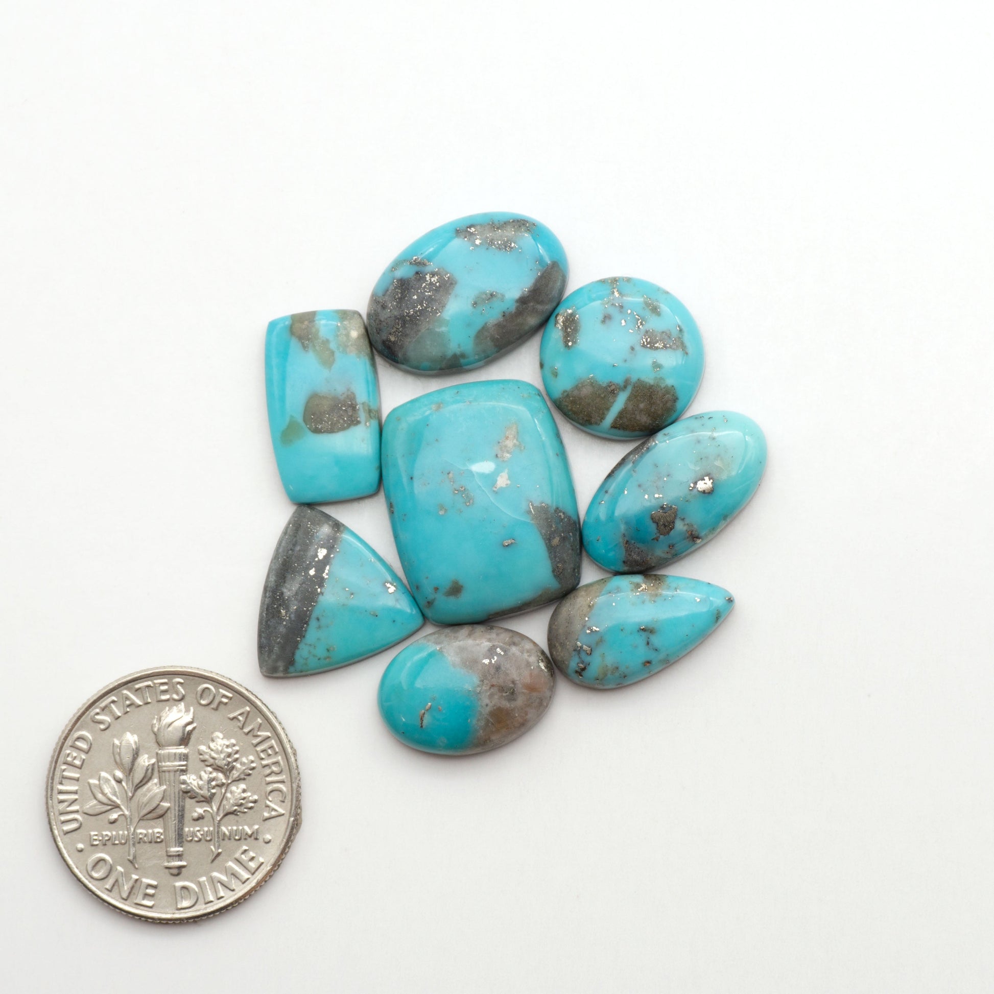 Nacozari turquoise cabochons are striking gemstones known for their vibrant blue to greenish-blue colors and pyrite, these stones are prized in jewelry making.