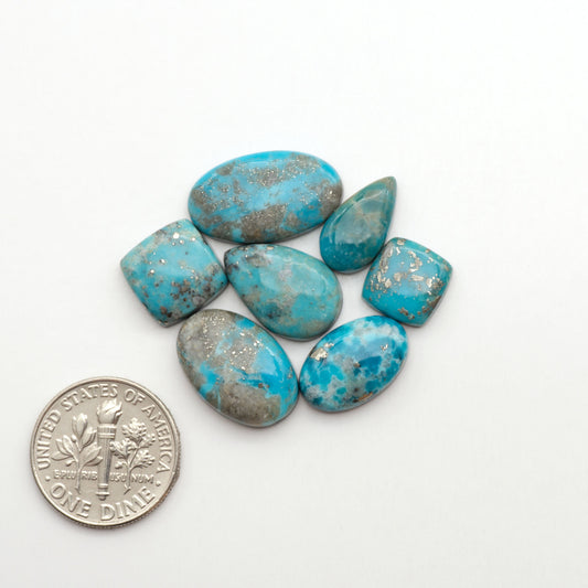 Nacozari turquoise cabochons are striking gemstones known for their vibrant blue to greenish-blue colors and pyrite, these stones are prized in jewelry making.