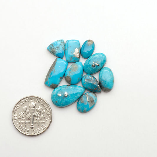 Nacozari turquoise cabochons are striking gemstones known for their vibrant blue to greenish-blue colors and pyrite, these stones are prized in jewelry making.