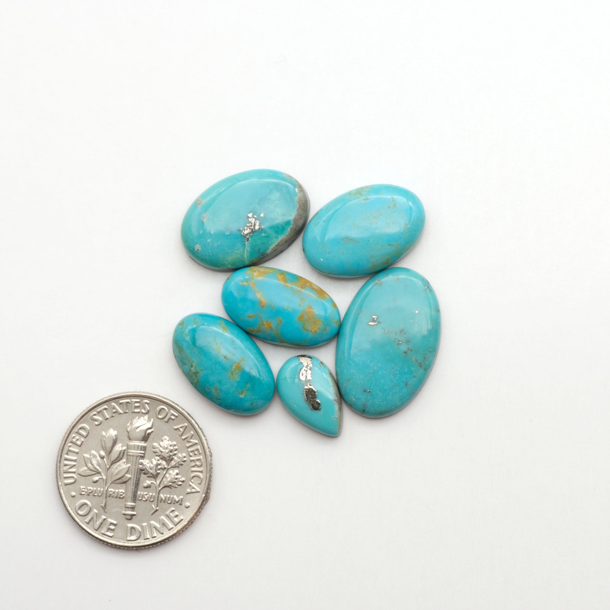 Nacozari turquoise cabochons are striking gemstones known for their vibrant blue to greenish-blue colors and pyrite, these stones are prized in jewelry making.