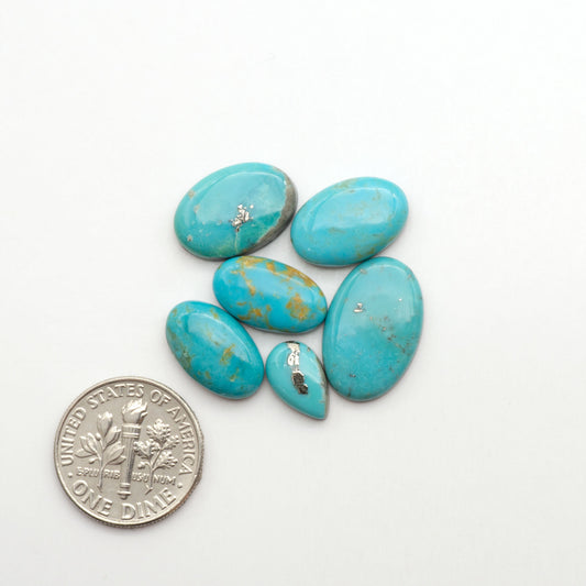 Nacozari turquoise cabochons are striking gemstones known for their vibrant blue to greenish-blue colors and pyrite, these stones are prized in jewelry making.