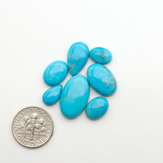 Nacozari turquoise cabochons are striking gemstones known for their vibrant blue to greenish-blue colors and pyrite, these stones are prized in jewelry making.