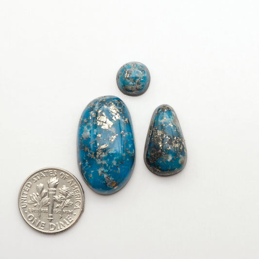 Nacozari turquoise cabochons are striking gemstones known for their vibrant blue to greenish-blue colors and pyrite, these stones are prized in jewelry making.