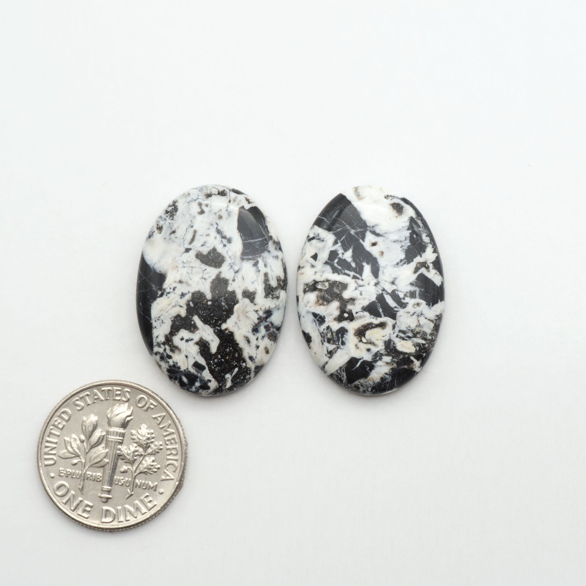 Natural White Buffalo Stone Cabochons are semi-precious gemstones cut into shapes ideal for jewelry-making, making them an excellent choice for artisans.