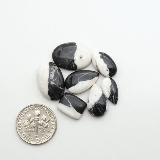 Natural White Buffalo Stone Cabochons are semi-precious gemstones cut into shapes ideal for jewelry-making, making them an excellent choice for artisans.