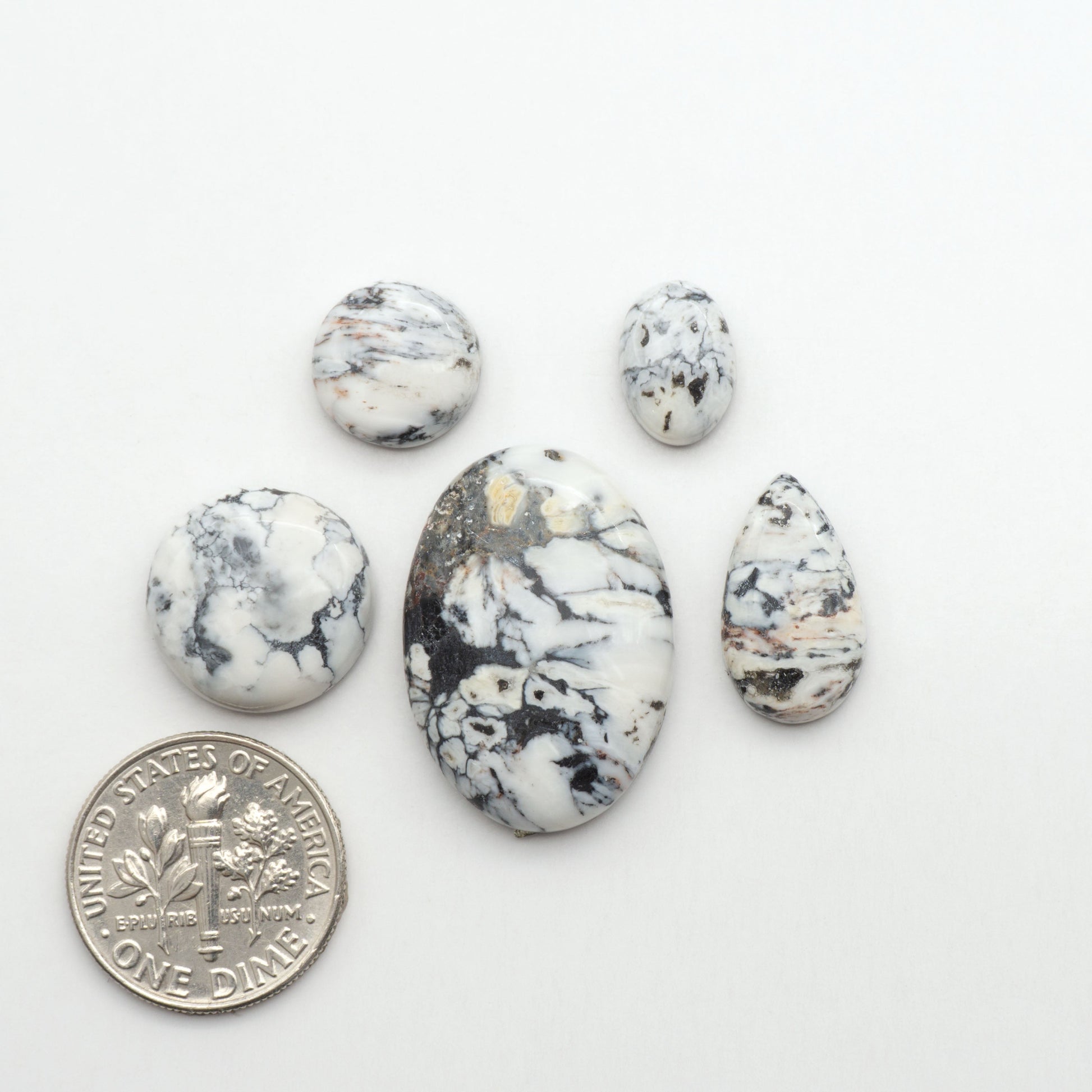 Natural White Buffalo Stone Cabochons are semi-precious gemstones cut into shapes ideal for jewelry-making, making them an excellent choice for artisans.