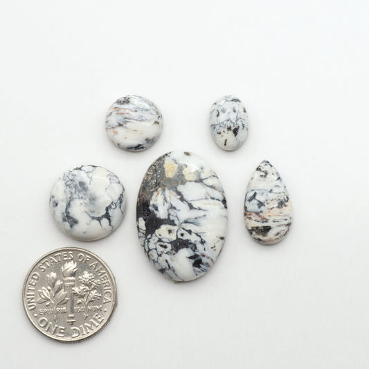 Natural White Buffalo Stone Cabochons are semi-precious gemstones cut into shapes ideal for jewelry-making, making them an excellent choice for artisans.