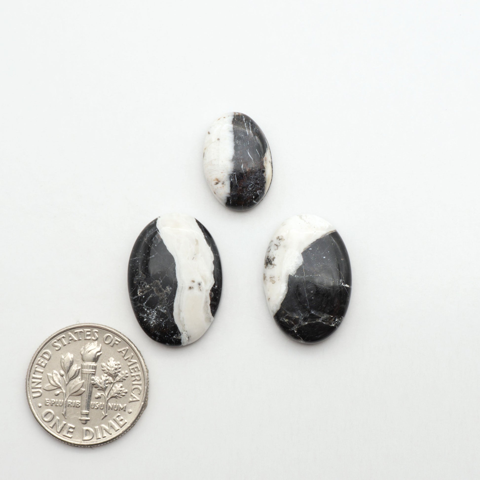 Natural White Buffalo Stone Cabochons are semi-precious gemstones cut into shapes ideal for jewelry-making, making them an excellent choice for artisans.