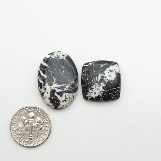 Natural White Buffalo Stone Cabochons are semi-precious gemstones cut into shapes ideal for jewelry-making, making them an excellent choice for artisans.