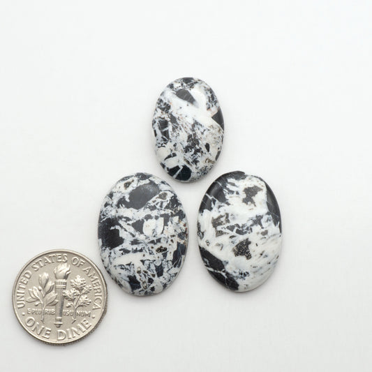 Natural White Buffalo Stone Cabochons are semi-precious gemstones cut into shapes ideal for jewelry-making, making them an excellent choice for artisans.