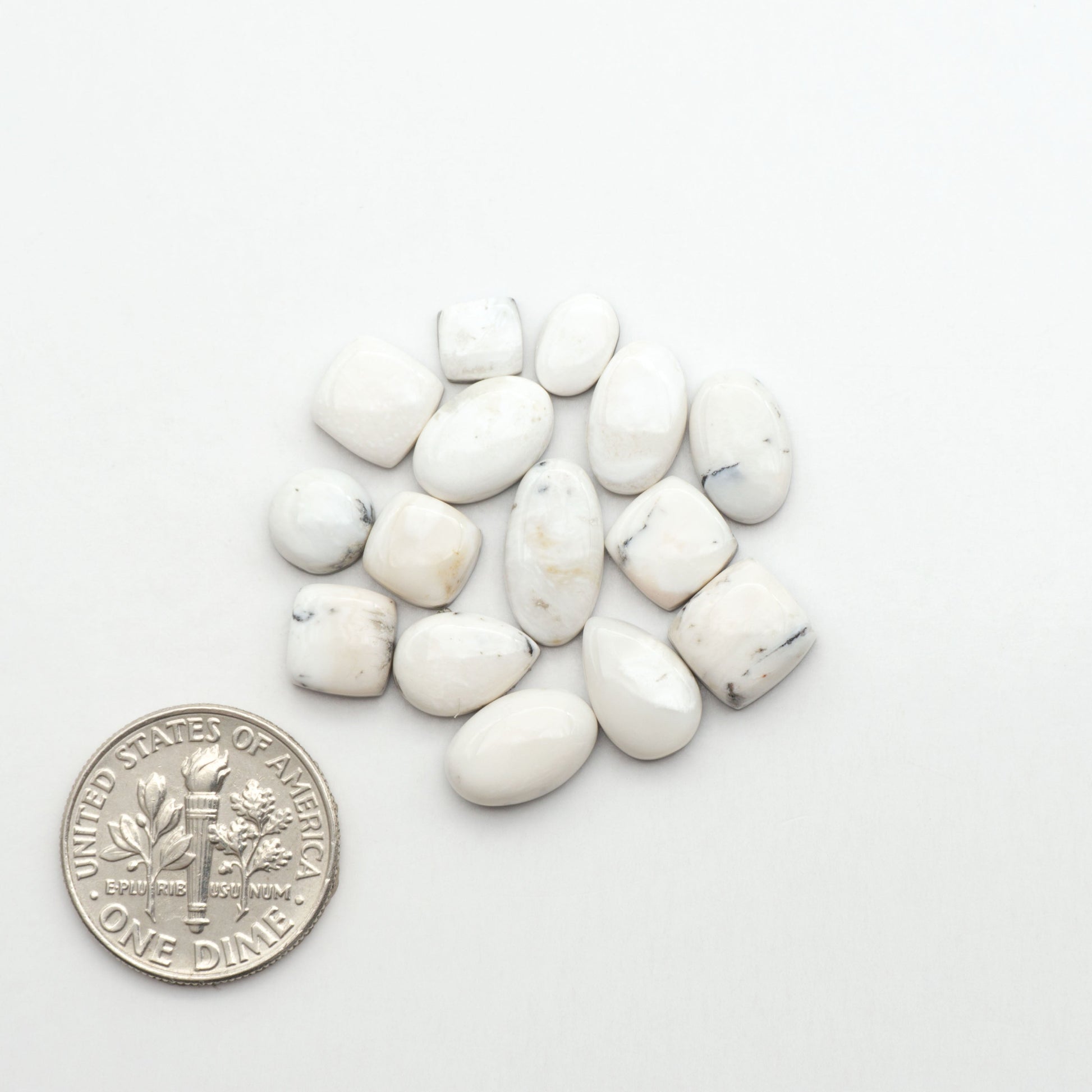 Natural White Buffalo Stone Cabochons are semi-precious gemstones cut into shapes ideal for jewelry-making, making them an excellent choice for artisans.