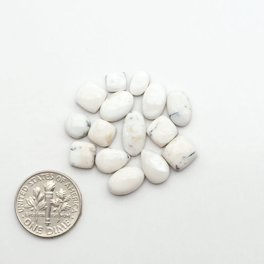 Natural White Buffalo Stone Cabochons are semi-precious gemstones cut into shapes ideal for jewelry-making, making them an excellent choice for artisans.