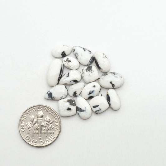 Natural White Buffalo Stone Cabochons are semi-precious gemstones cut into shapes ideal for jewelry-making, making them an excellent choice for artisans.