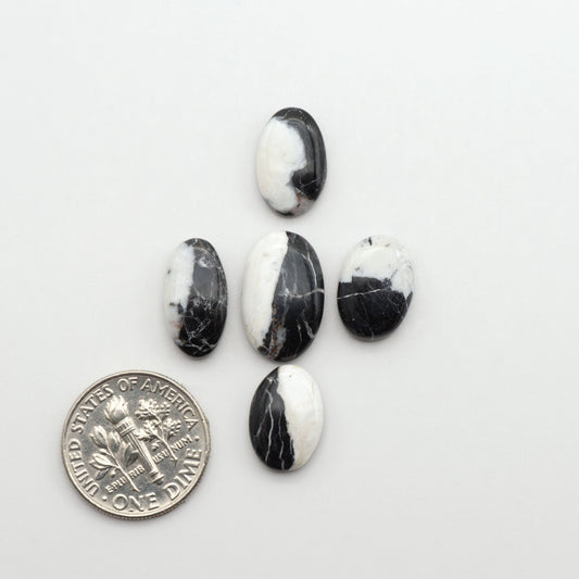 Natural White Buffalo Stone Cabochons are semi-precious gemstones cut into shapes ideal for jewelry-making, making them an excellent choice for artisans.