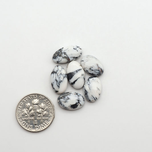 Natural White Buffalo Stone Cabochons are semi-precious gemstones cut into shapes ideal for jewelry-making, making them an excellent choice for artisans.