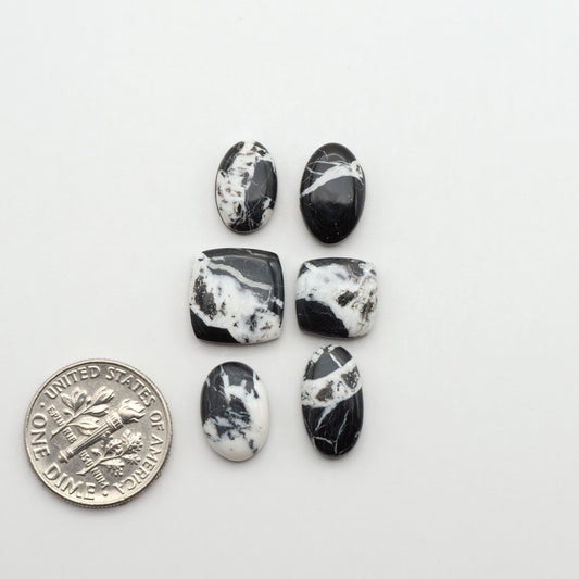 Natural White Buffalo Stone Cabochons are semi-precious gemstones cut into shapes ideal for jewelry-making, making them an excellent choice for artisans.