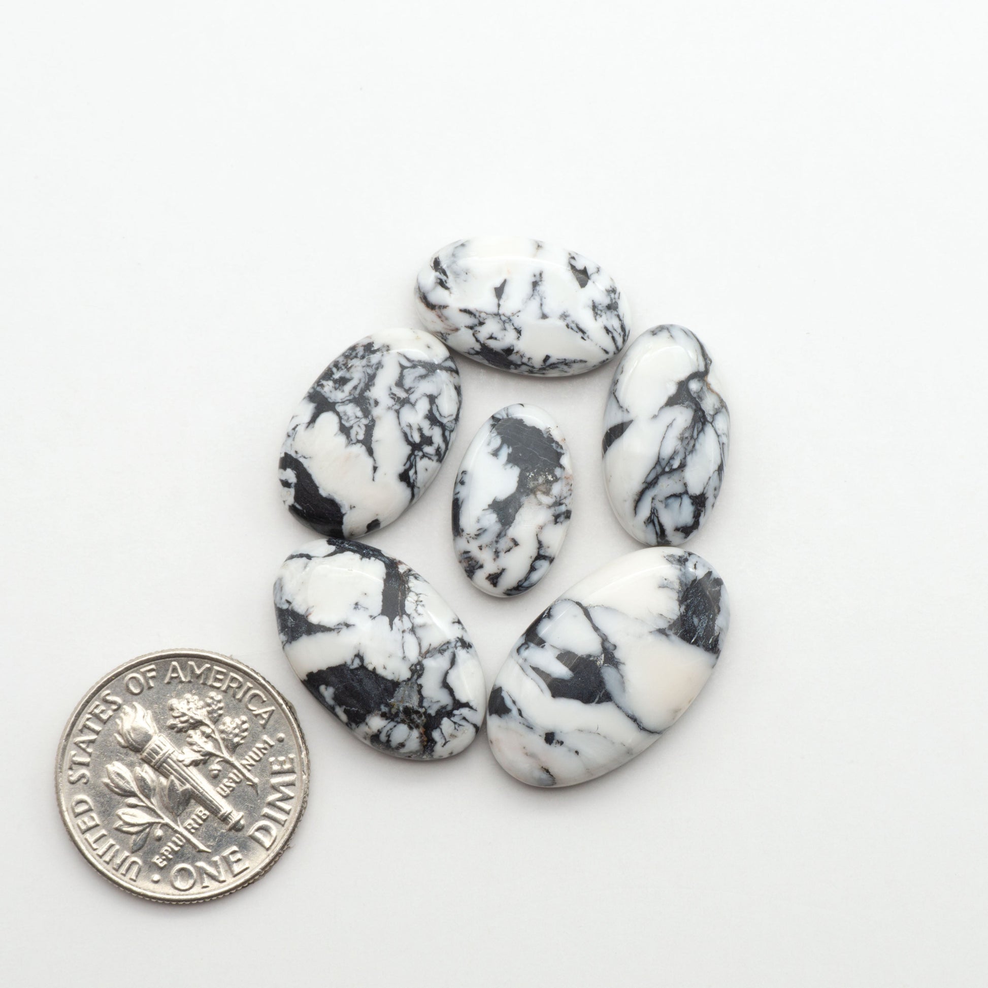 Natural White Buffalo Stone Cabochons are semi-precious gemstones cut into shapes ideal for jewelry-making, making them an excellent choice for artisans.
