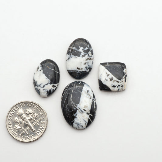Natural White Buffalo Stone Cabochons are semi-precious gemstones cut into shapes ideal for jewelry-making, making them an excellent choice for artisans.
