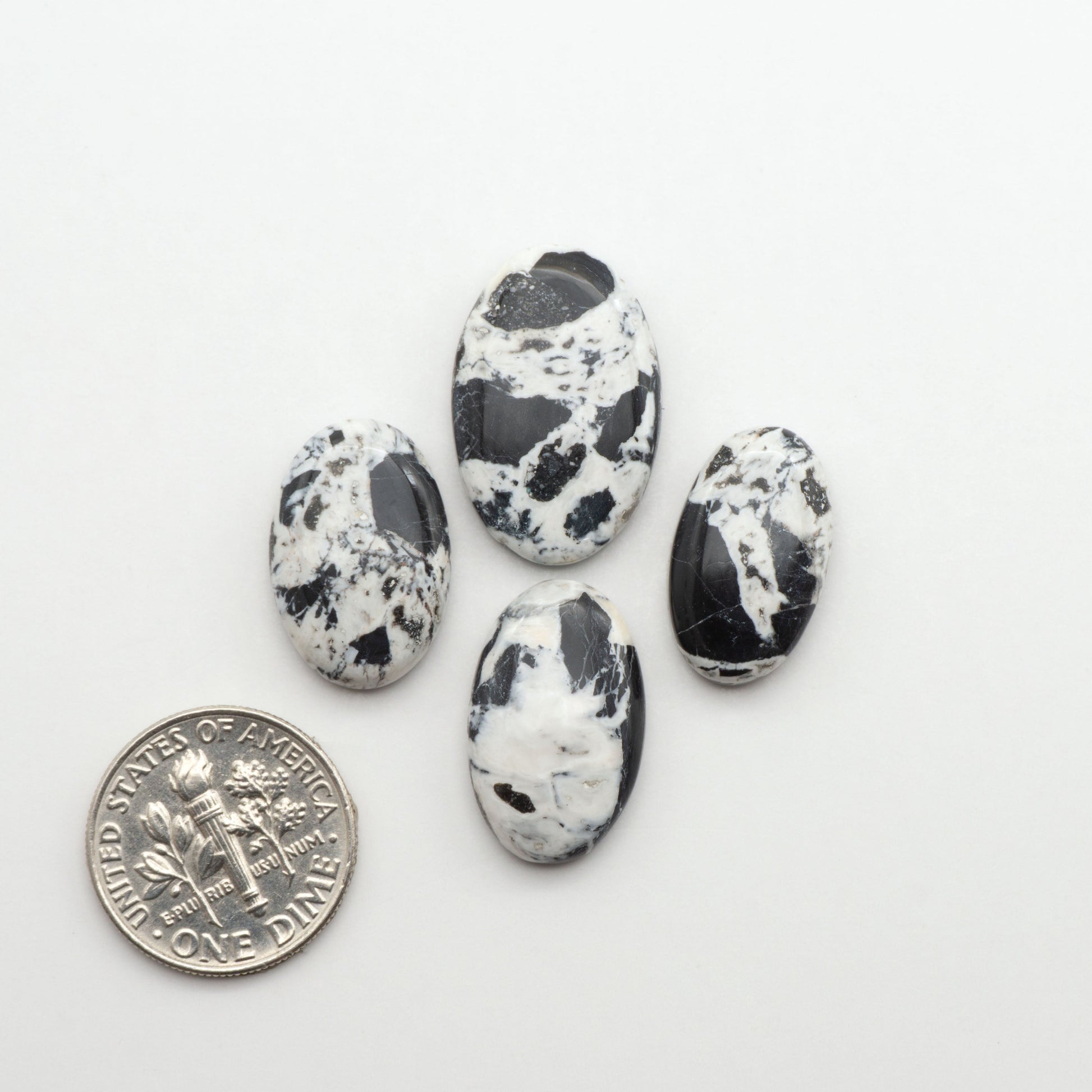Natural White Buffalo Stone Cabochons are semi-precious gemstones cut into shapes ideal for jewelry-making, making them an excellent choice for artisans.