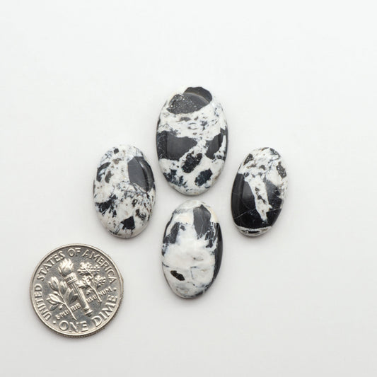 Natural White Buffalo Stone Cabochons are semi-precious gemstones cut into shapes ideal for jewelry-making, making them an excellent choice for artisans.