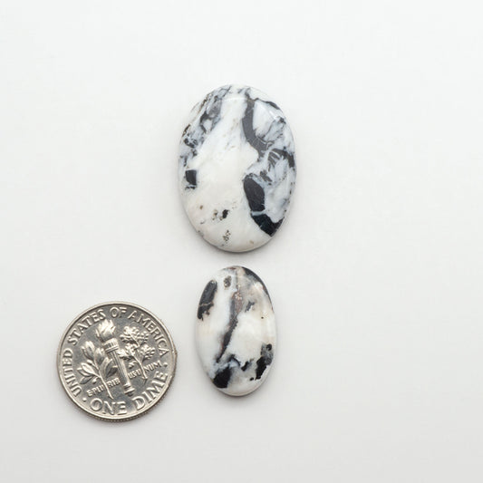 Natural White Buffalo Stone Cabochons are semi-precious gemstones cut into shapes ideal for jewelry-making, making them an excellent choice for artisans.