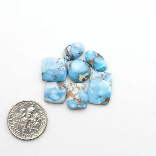 Discover the beauty of Natural Golden Hills Turquoise—prized for its icy blue tones, golden matrix, and exceptional quality. Ideal for artisan jewelry designs.